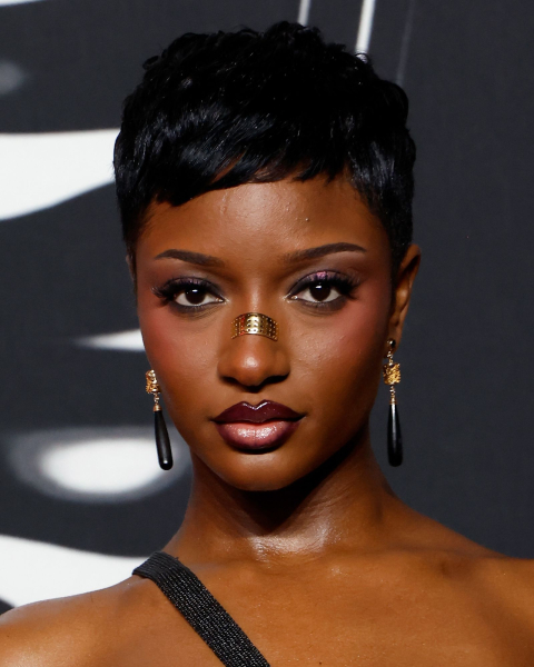 Closeup shot of Ayra Starr with a refined pixie cut